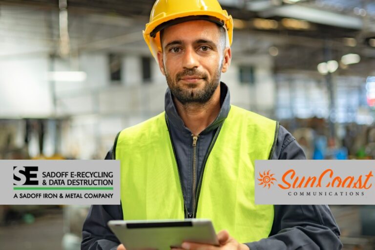 Man in a telecom warehouse with Sadoff and SunCoast logos