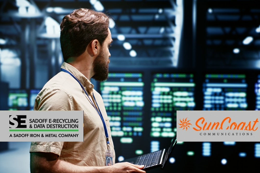 Man overlooking a data center with Suncoast and Sadoff logo
