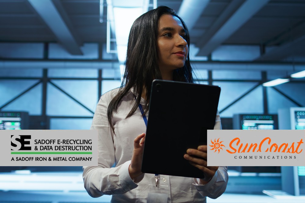 Woman reviewing data center with Suncoast and Sadoff logo