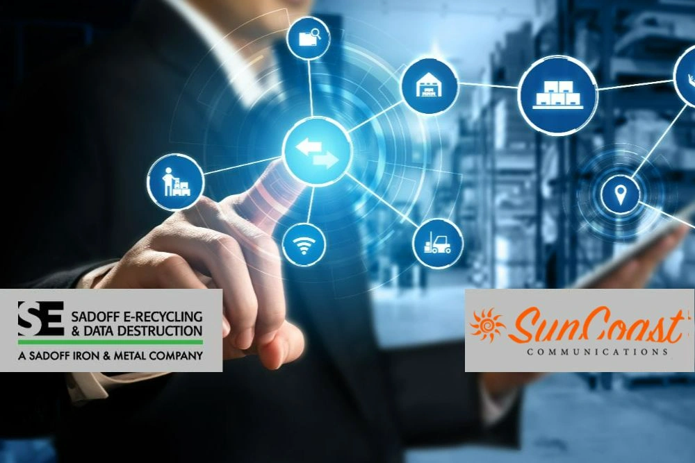 Man using a stylized digital interfact to manager a telecom warehouse with Sadoff and SunCoast logos