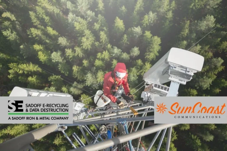 Man on cell tower working on equipment with Sadoff and SunCoast logos